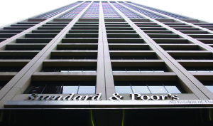 The Standard and Poor's sign hangs from their building headquarters in New York on Friday, Mar. 6, 2009. Photographer: Jin Lee/Bloomberg News